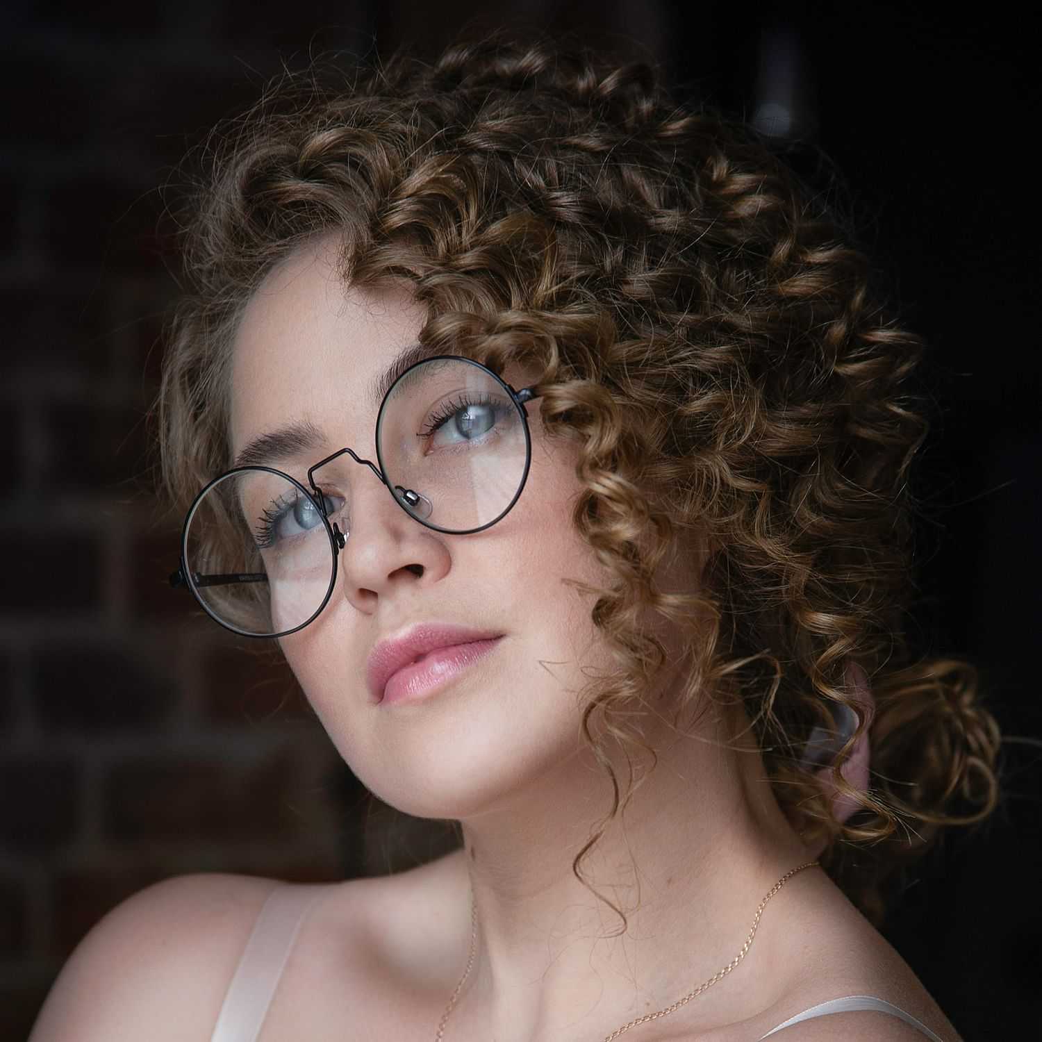 Portrait of Ella Thompson, a professional stylist at Wisp Nail Salon & Spa, showcasing their expertise and style.